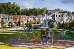 A view of a playground in a townhome complex
